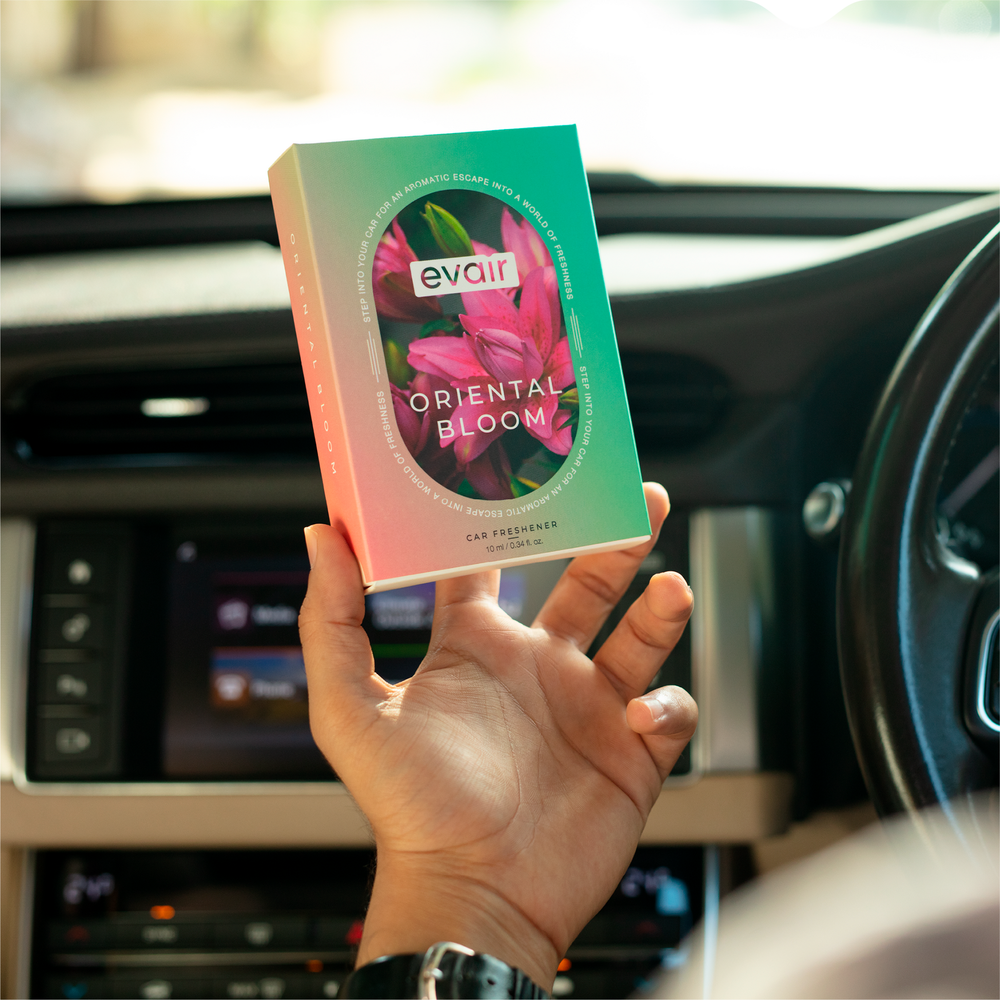 Men Holding Evair Oriental Bloom Long lasting Car Perfume in car